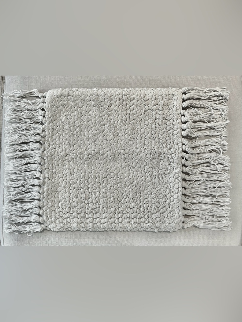 Pottery Barn white textured tassel pillow cover by Lily Ashwell